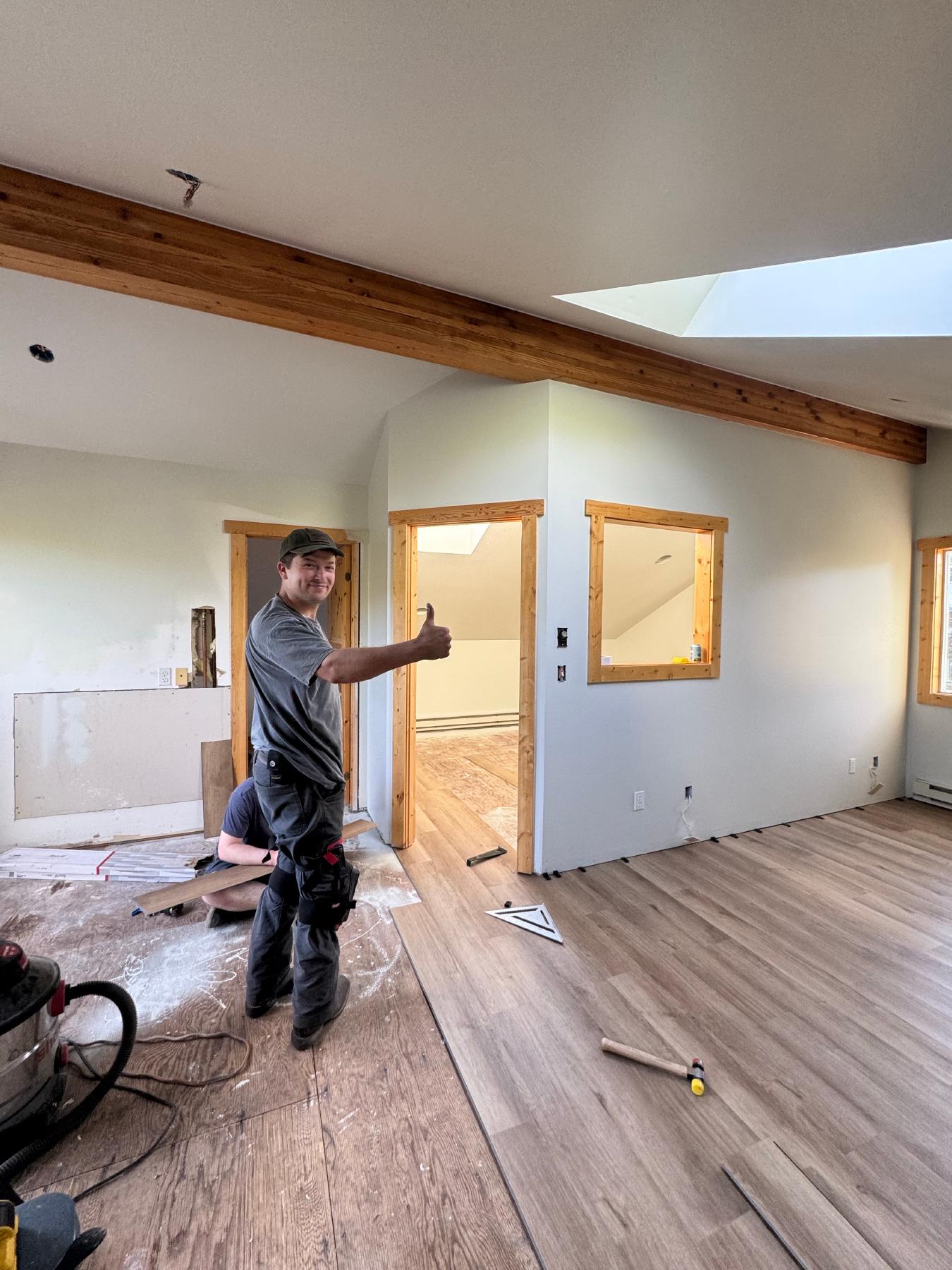 Sky working on flooring and interior finishing